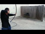 PC’s last stand! Man shoots arrows into computer with pvc bow.
